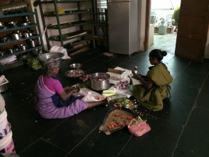 Ladies in the back room prepping for the next meal. Men prep too, but we always them sitting in a separate circle. 